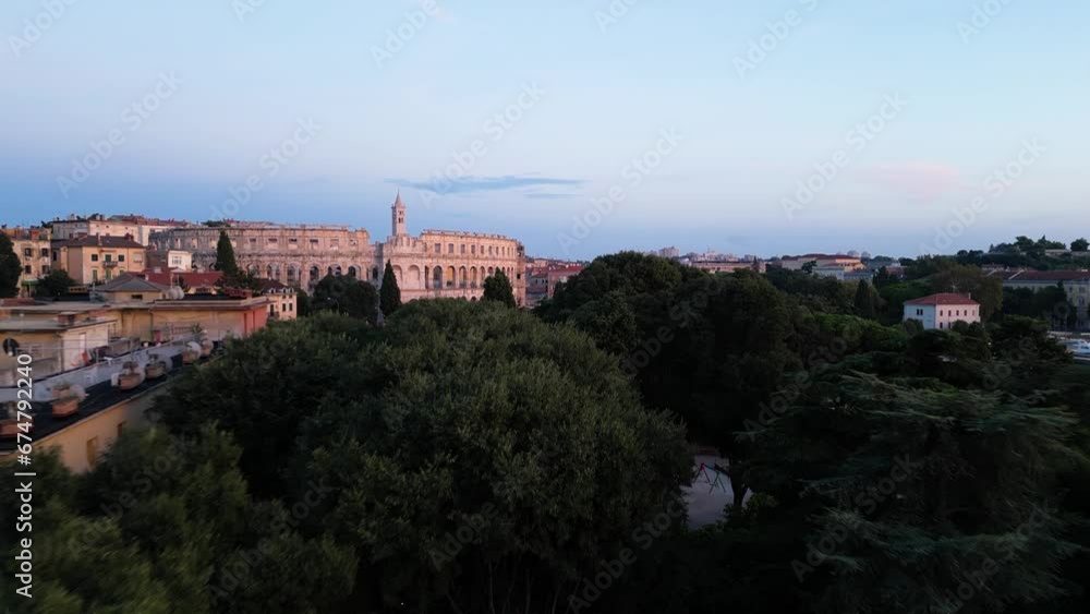 Aerial view of the Pula Amphitheater arena at sunset, a Roman Amphitheater with underground museum in Pula downtown, Istria, Croatia. Aerial view of the Pula Amphitheater arena at sunset, a Roman Amphitheater with underground museum in Pula downtown, Istria, Croatia.