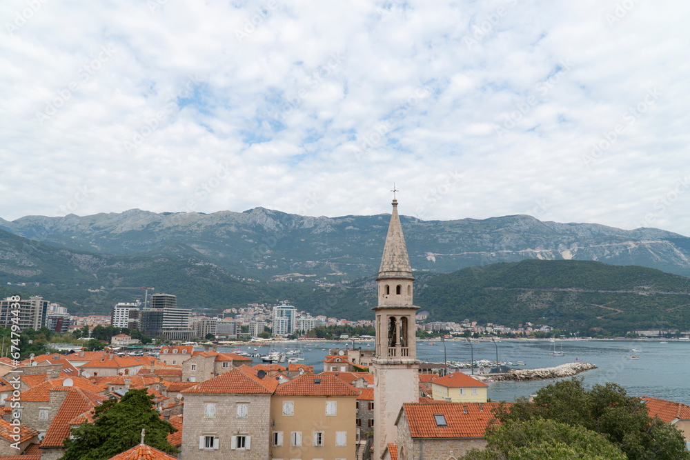 Fototapeta premium View of church tower in Budva, from citadel in old town, Montenegro. 