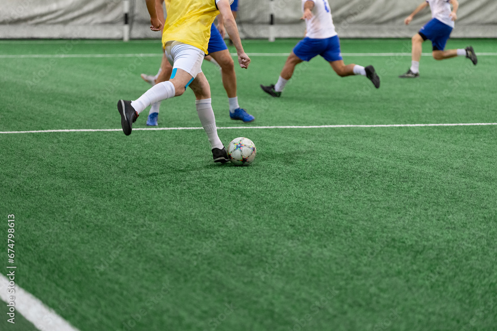 Futsal players rivals in action. Sport five a side concept.