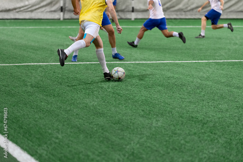 Futsal players rivals in action. Sport five a side concept.