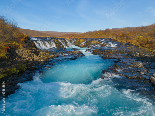 Aerial top view of Bruarfoss waterfall in autumn season in Iceland. Famous nature landscape background