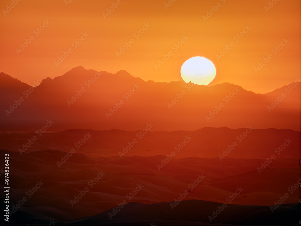 California monochromatic sunrise with gradients over mountains and desert sand dunes