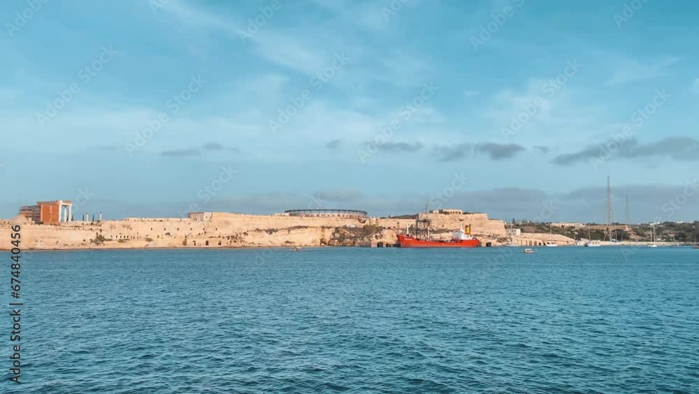 Fort Rikazli or Fort Ricasoli, Kalkara view from the sea. Gladiator arena in the middle of the fortress. Timelapse from the sea. High quality 4k footage Fort Rikazli or Fort Ricasoli, Kalkara view from the sea. Gladiator arena in the middle of the fortress. Timelapse from the sea. High quality 4k footage