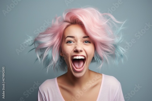A woman with vibrant pink and blue hair making a hilarious facial expression. This image can be used to add a touch of humor and uniqueness to various projects