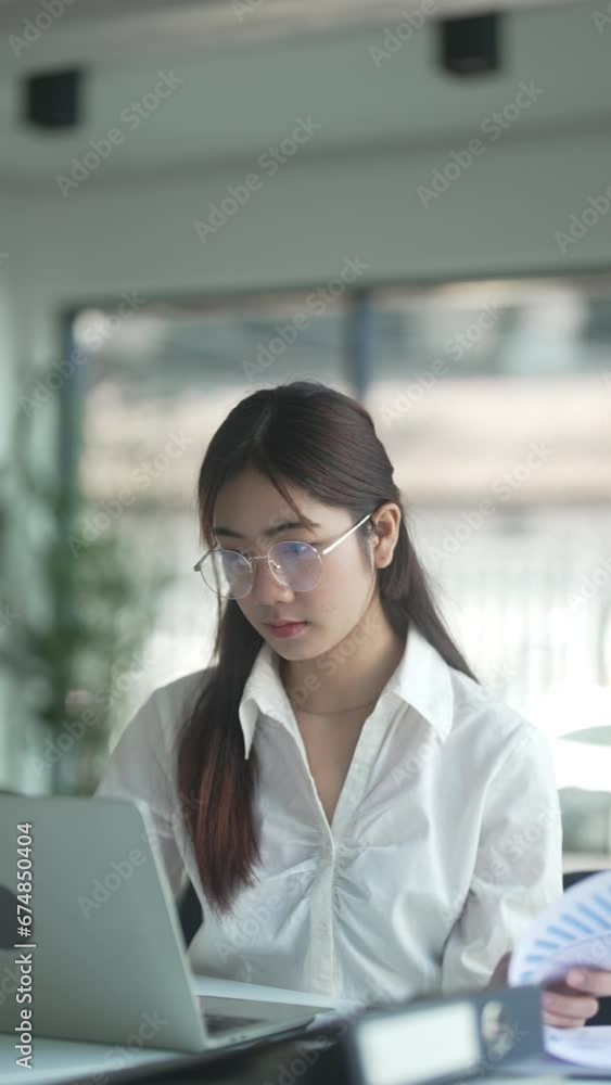 Female secretary worker working on office desk searching about data . Female secretary worker working on office desk searching about data .