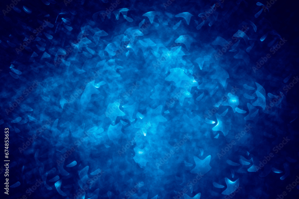 Obraz premium snowflake and stars neutral shaped structured blue background with bokeh effect