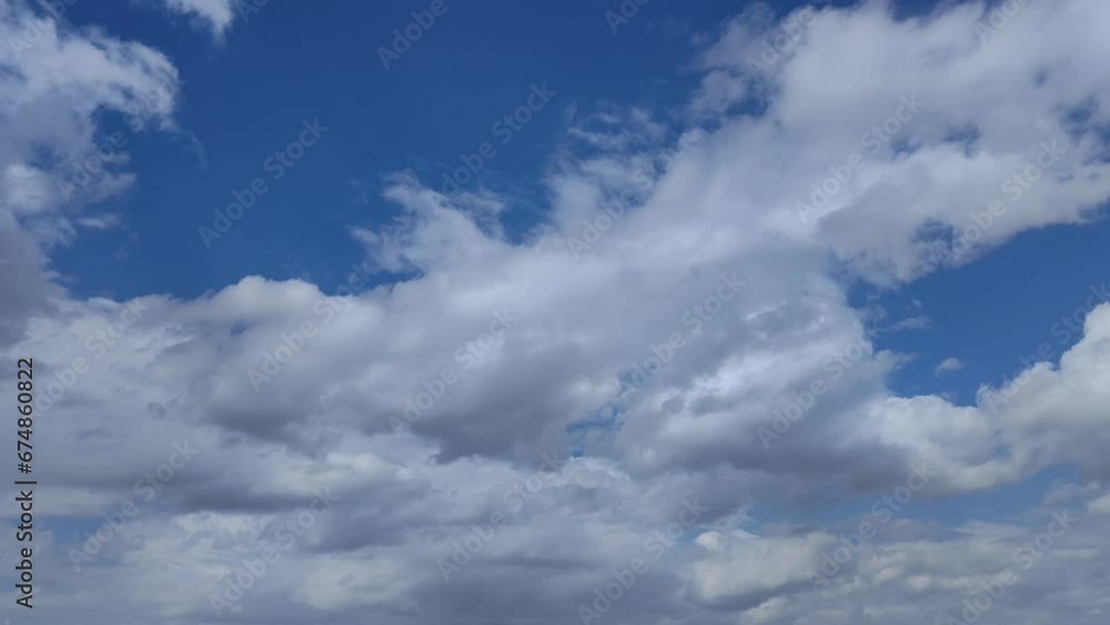 Beautiful afternoon shot of the sky full of white stratocumulus clouds Beautiful afternoon shot of the sky full of white stratocumulus clouds