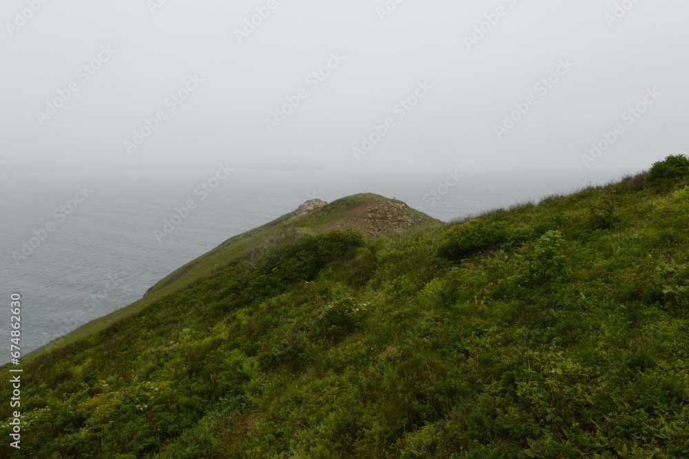 Passing cape on Popov Island in Peter the Great Bay of the Sea of Japan Passing cape on Popov Island in Peter the Great Bay of the Sea of Japan