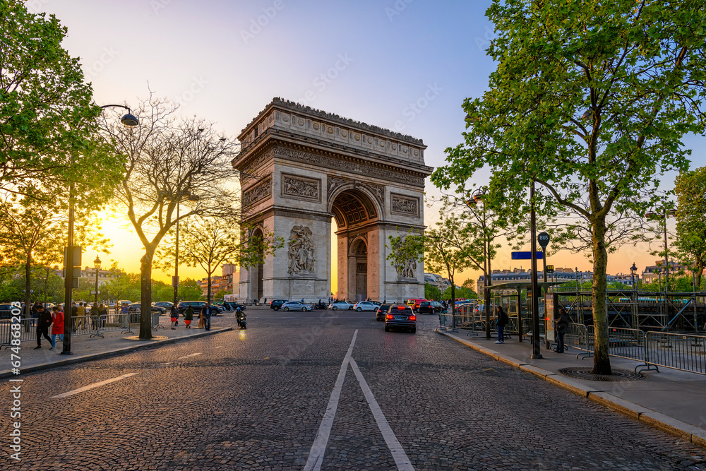 Paris Arc de Triomphe (Triumphal Arch) in Chaps Elysees at sunset, Paris, France. Cityscape of Paris. Architecture and landmarks of Paris - obrazy, fototapety, plakaty 