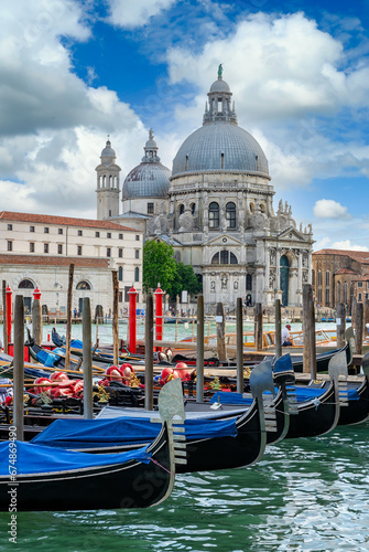 Grand canal with gondola and Basilica di Santa Maria della Salute in Venice, Italy. Architecture and landmarks of Venice. Venice postcard © Ekaterina Belova