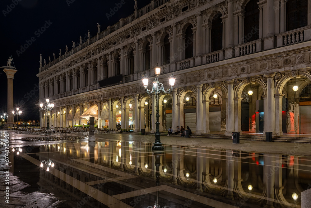 Night view of piazza San Marco with tables of cafe in Venice, Italy. Architecture and landmark of Venice. Night cityscape of Venice.