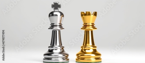 Leader or winner / conqueror concept : Side view of gold / golden king chess piece with silver knight and bishop nearby, on a black white 8x8 grid chessboard. Chess is a two player strategy board game photo