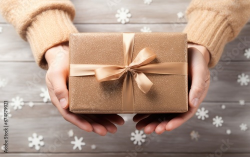 Hands holding a box that is...