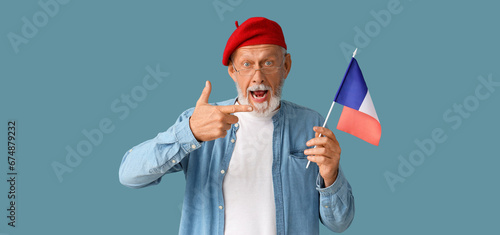 Mature man holding flag of ...