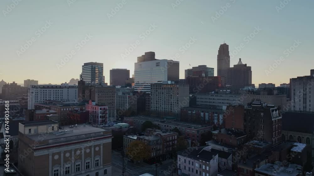 Downtown Cincinnati, Ohio early in the morning going up to a light reveal of the sun. Downtown Cincinnati, Ohio early in the morning going up to a light reveal of the sun.