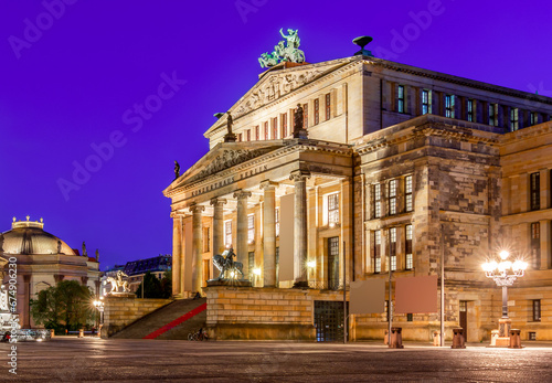 Concert Hall  Konzerthaus  and New Church  Deutscher Dom or Neue Kirche  on Gendarmenmarkt square at night in Berlin  Germany