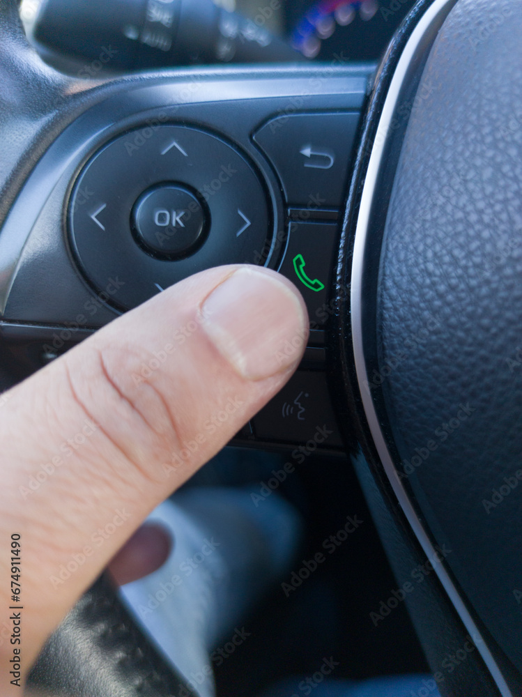 Driver about to pick up the phone Driver about to pick up the phone