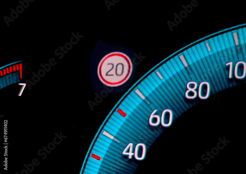 Speed limit warning close to speedometer indicator