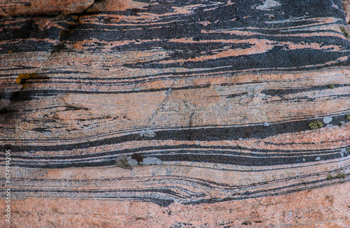 Grey and pink gneiss metamorphic rock. photo