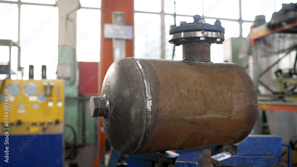 Pipe for a water tank. Steel pipe material. Water tank capacity. Heavy industry, metal products. Pipe production plant. Pipe for a water tank. Steel pipe material. Water tank capacity. Heavy industry, metal products. Pipe production plant.
