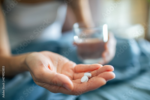 Close up of hand with two pills photo