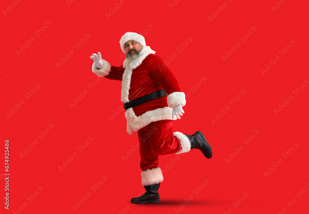 Dancing Santa Claus on red background Dancing Santa Claus on red background