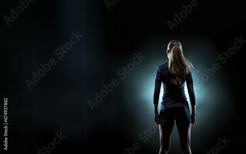 photorealistic silhouette image of a volleyball player wearing long sleeves and kneepads, dramatic blue lighting