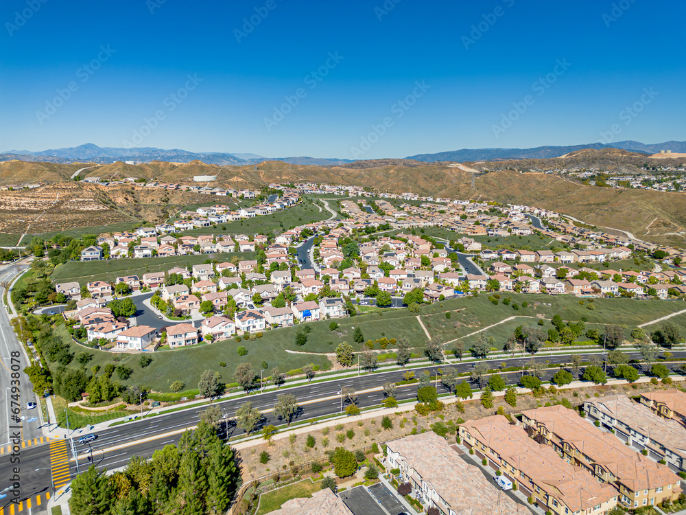Valencia, California - October 24, 2023: aerial drone photo view toward  West Creek Townhouse in Valencia with new townhouse homes and West Creek Park