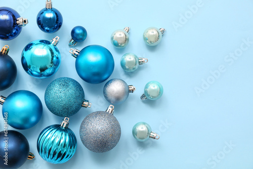 Composition with Christmas balls on blue background