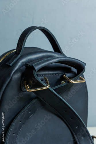 Women's leather black backpack on the shoulder. Handmade leather backpack.