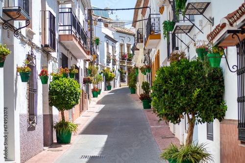 Walking in city center on sunny summer day in Estepona  Spain