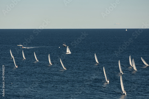 A lot of sail boats and yachts in the sea went on a sailing trip near port Hercules in Monaco, Monte Carlo, sail regatta, race