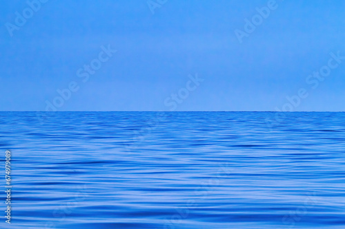 Brtilliant blue ocean with a brilliant blue cloudless sky.