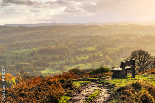 A magnificent view down the Derwent Valley and Chatsworth Park can be found from this bench situated at the end of Baslow Edge in the Peak District National Park. photo