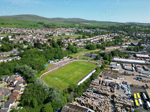 Picturesque rural village in Scotland, with a gleaming football stadium in the foreground