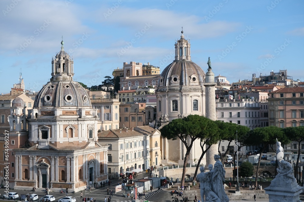 View of Santa Maria di Loreto and Santissimo Nome di Maria church and Trajan Column in Rome, Italy