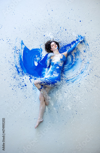 naked sensual woman full of feeling, emotion in blue and white color painted. Decorative creative expressive abstract body painting art