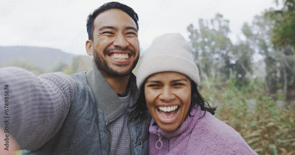 Couple, hiking in nature and selfie of kiss or camping, adventure or happy travel on social media or bonding together outdoor. People, happy face and peace on holiday, journey or mountain hike Couple, hiking in nature and selfie of kiss or camping, adventure or happy travel on social media or bonding together outdoor. People, happy face and peace on holiday, journey or mountain hike