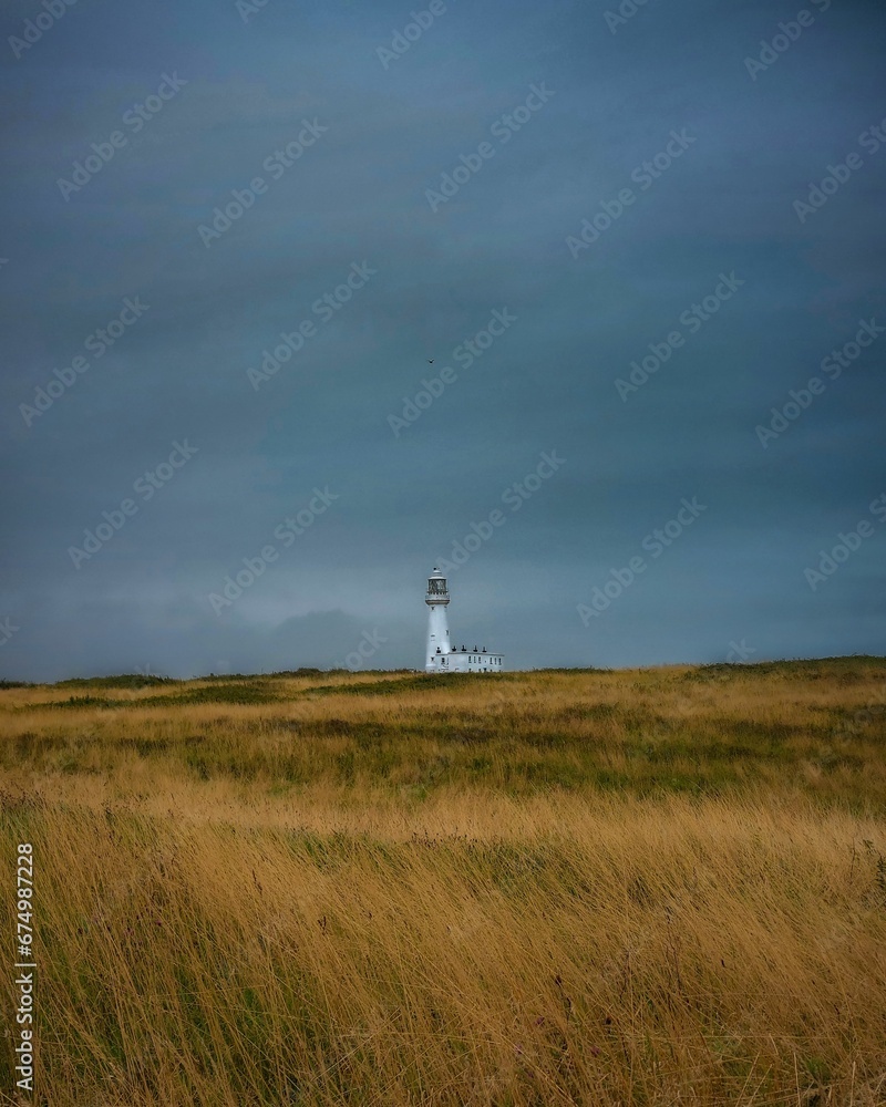 Lighthouse is located atop a grassy hill in Flamborough, Bridlington, United Kingdom