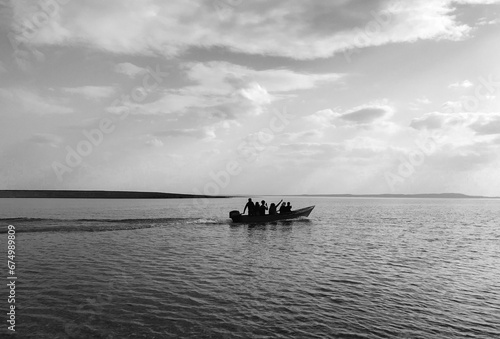 Boat in a lake full of people in Mosul Dam  Iraq