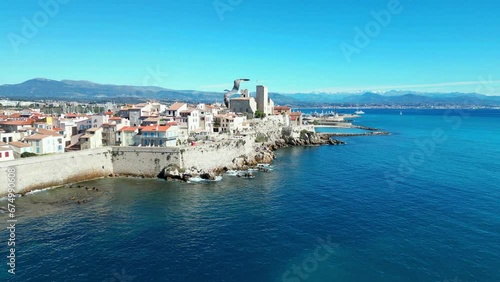 Drone view of Antibes town with Chateau Grimaldi castle along sea on a sunny day in France photo