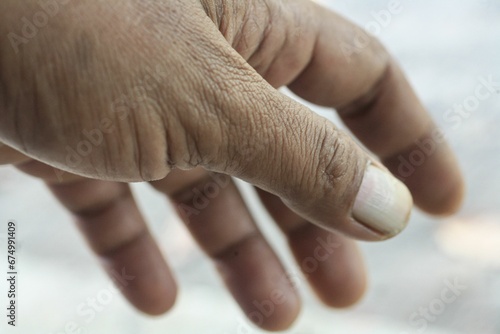 Close-up of a mans hand against a white background