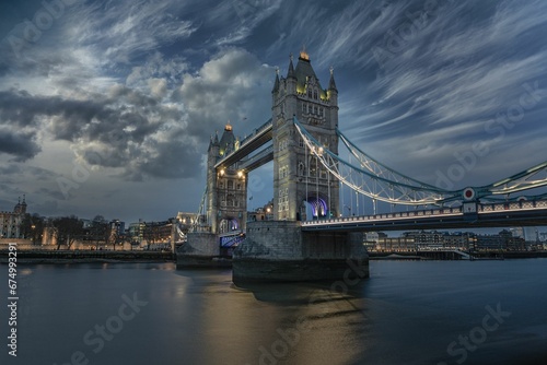 Scenic shot of the beautiful London Tower Bridge illuminated in the evening