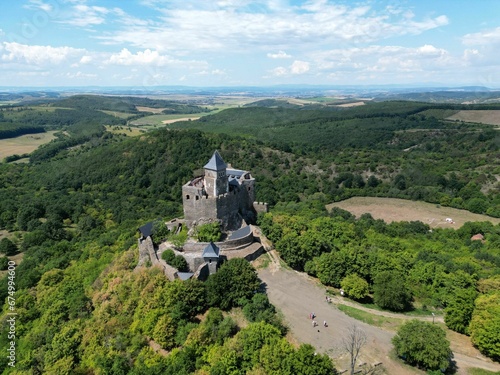 Aerial view of the historic Holloko castle atop a mountain in Hungary photo