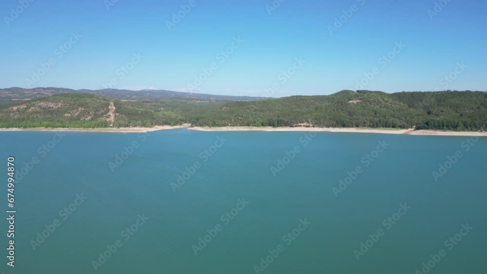 Drone over sea showing cliffs and blue sky in the background Drone over sea showing cliffs and blue sky in the background