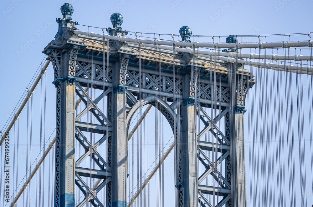 Fototapeta premium Manhattan Bridge between buildings in the Dumbo neighborhood in Brooklyn, NYC