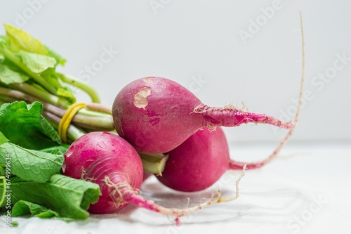 Closeup of a fresh vibrant radish on a white background