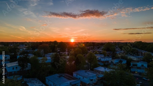 Aerial view of sunset over a residential district © Wirestock