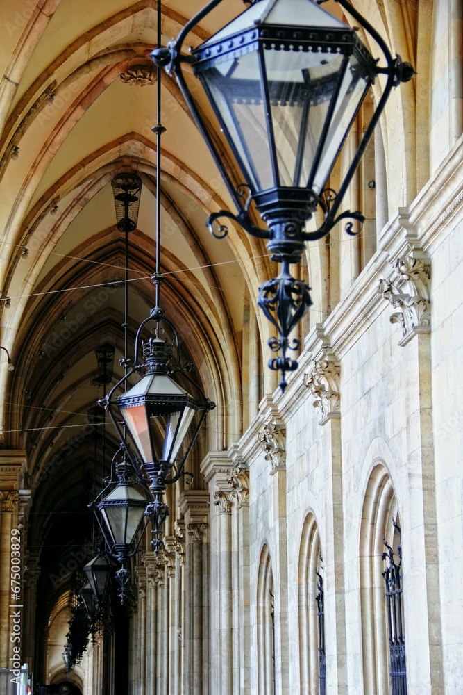Vertical shot of lanterns against the backdrop of a majestic cathedral interior
