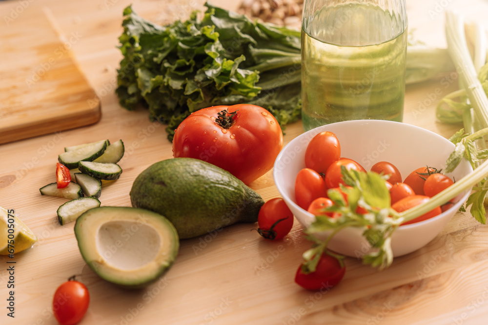 Fresh vegetables in white plates and on a wooden table. Fresh vegetables in white plates and on a wooden table.